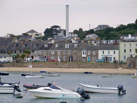 Boats in the water in front of houses